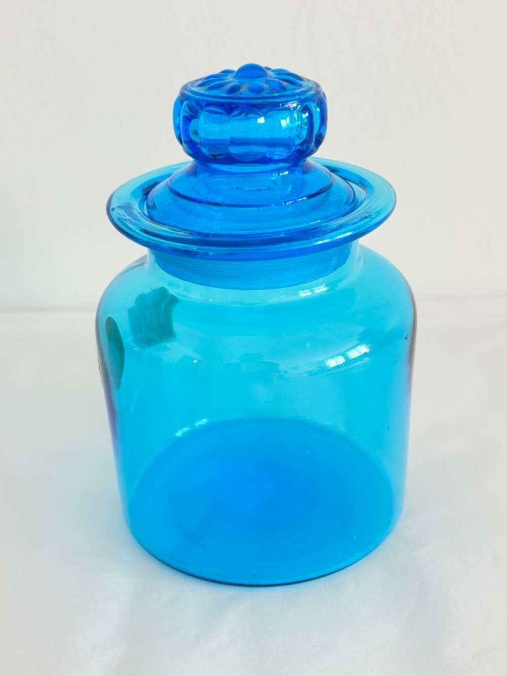 Vintage Mid century apothecary jar with daisy shaped lid hand blown blue glass
